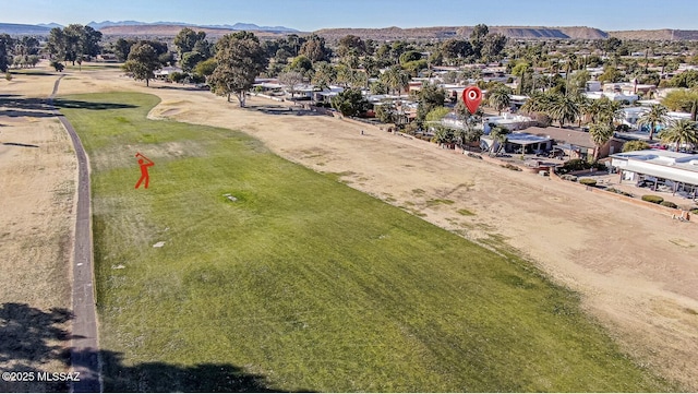 birds eye view of property featuring a mountain view