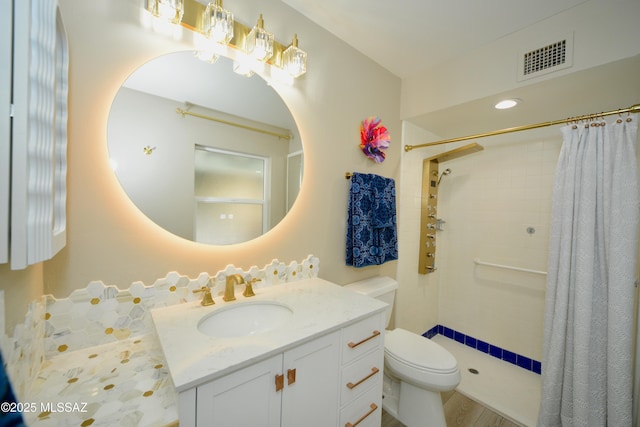 bathroom with vanity, toilet, and a shower with shower curtain