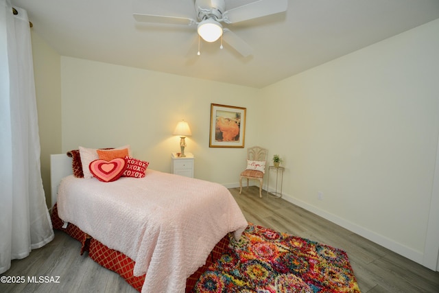 bedroom featuring ceiling fan and light hardwood / wood-style floors