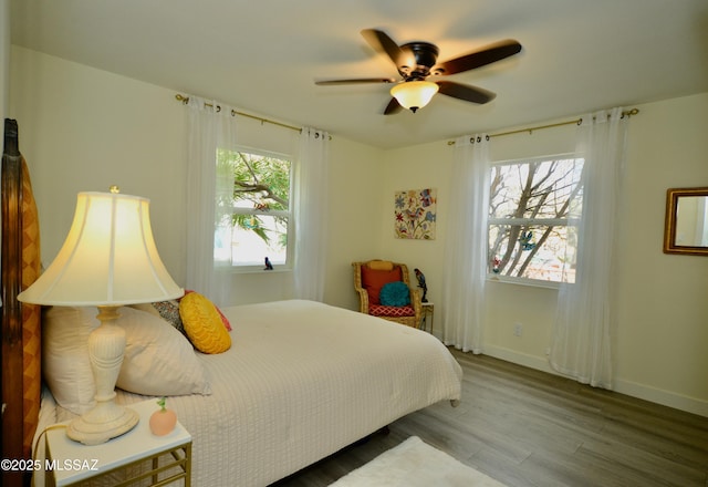 bedroom featuring hardwood / wood-style flooring and ceiling fan