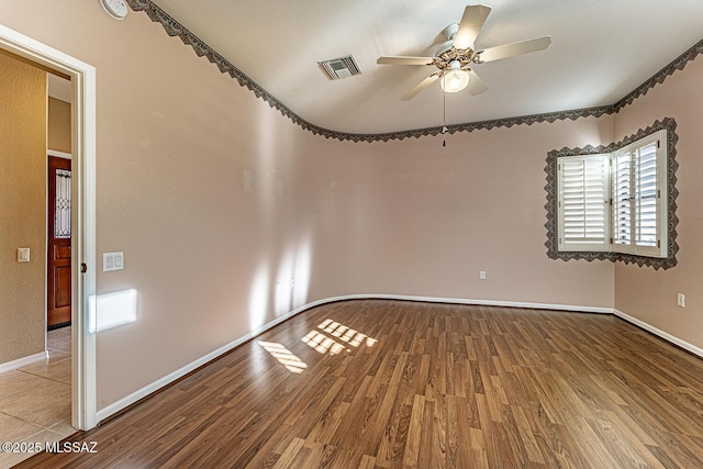 spare room featuring ceiling fan and light wood-type flooring