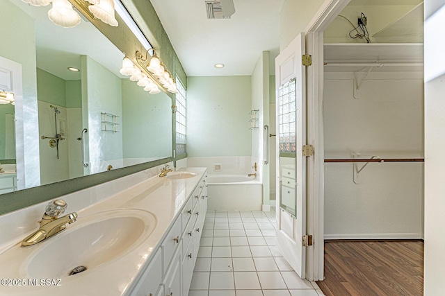 bathroom with vanity, tile patterned floors, and separate shower and tub