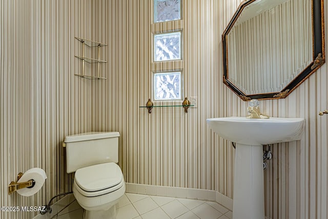 bathroom with tile patterned floors and toilet