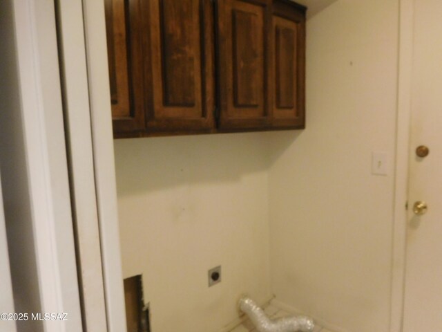 laundry area featuring cabinets and hookup for an electric dryer