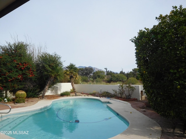 view of pool featuring a mountain view