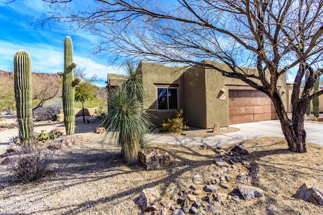 view of property exterior with a garage