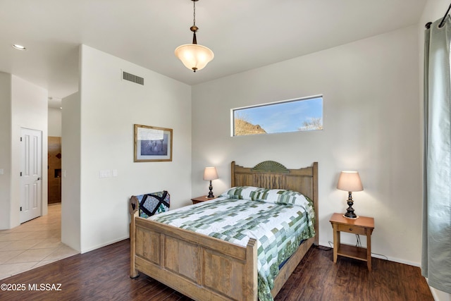 bedroom with hardwood / wood-style flooring