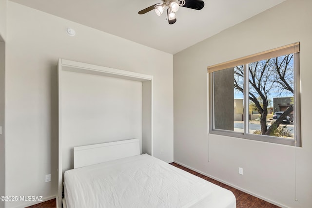 bedroom featuring dark hardwood / wood-style floors and ceiling fan