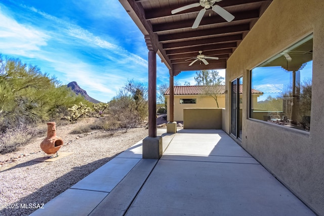 view of patio featuring ceiling fan