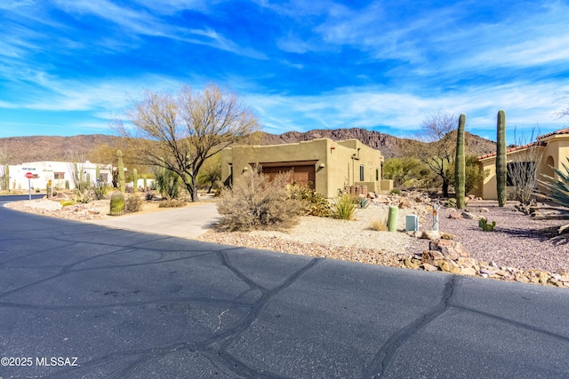 view of front of house featuring a mountain view