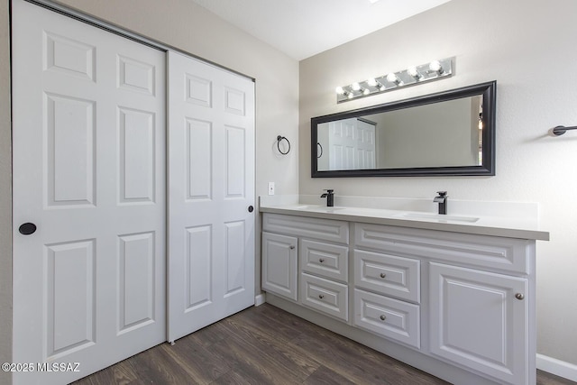 bathroom with wood-type flooring and vanity