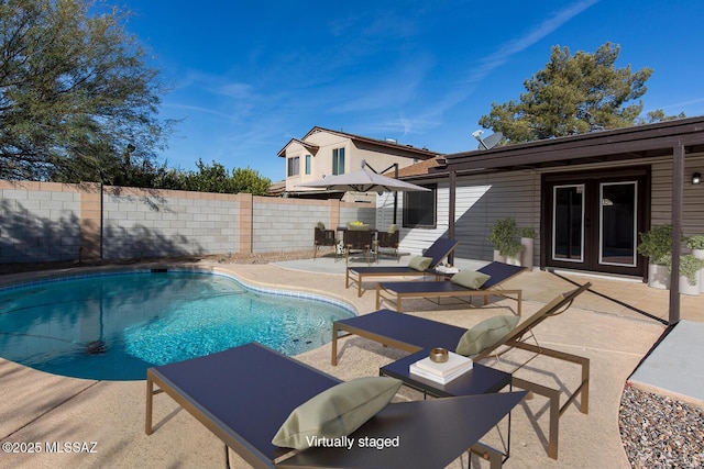 view of pool featuring a patio area