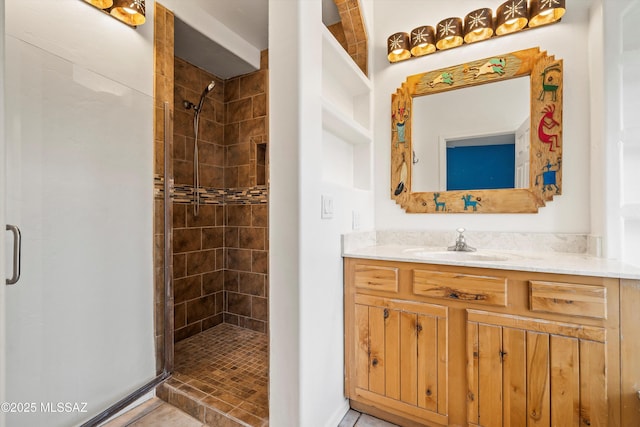 bathroom with vanity and an enclosed shower