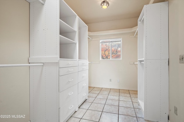 spacious closet with light tile patterned flooring