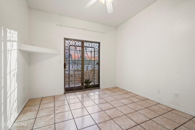 unfurnished room featuring light tile patterned flooring and ceiling fan