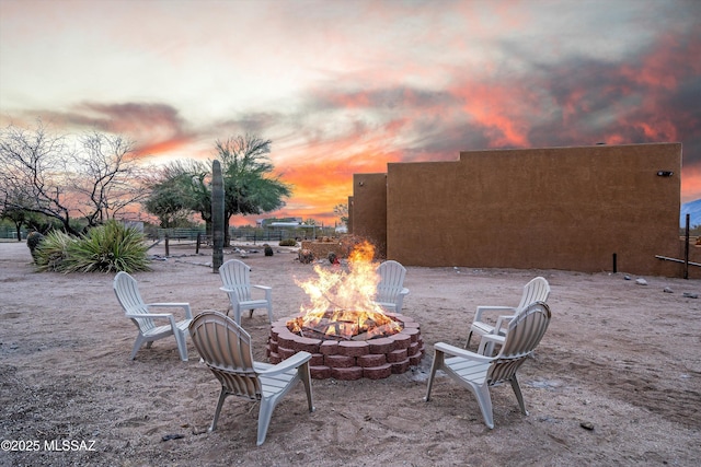 patio terrace at dusk with an outdoor fire pit