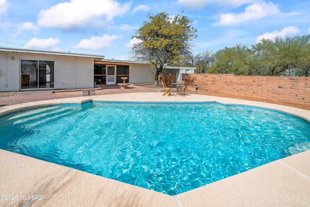 view of pool featuring a patio