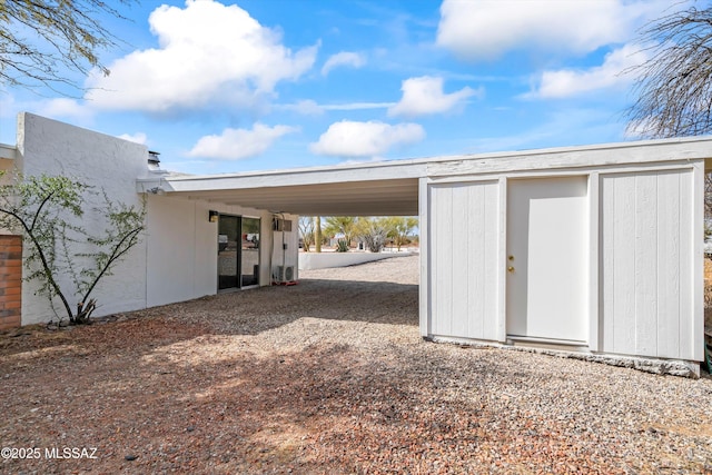 garage featuring a carport