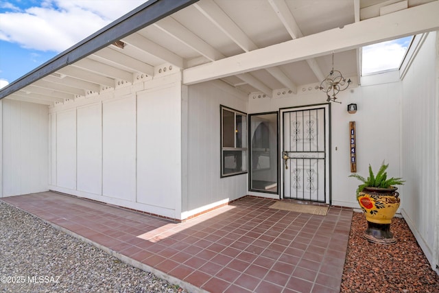 property entrance with a patio area