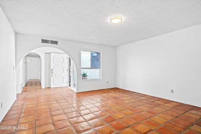 interior space featuring a textured ceiling