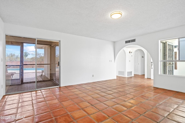 empty room featuring a textured ceiling