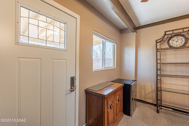 view of carpeted entrance foyer