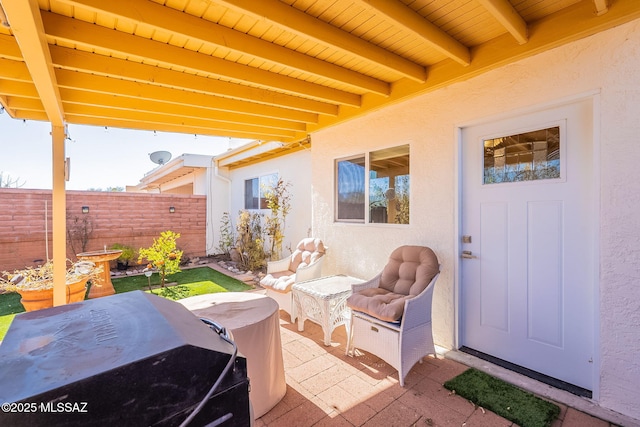 view of patio featuring a grill