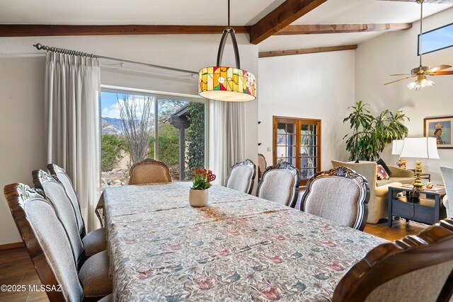 dining room featuring wood finished floors, plenty of natural light, and french doors