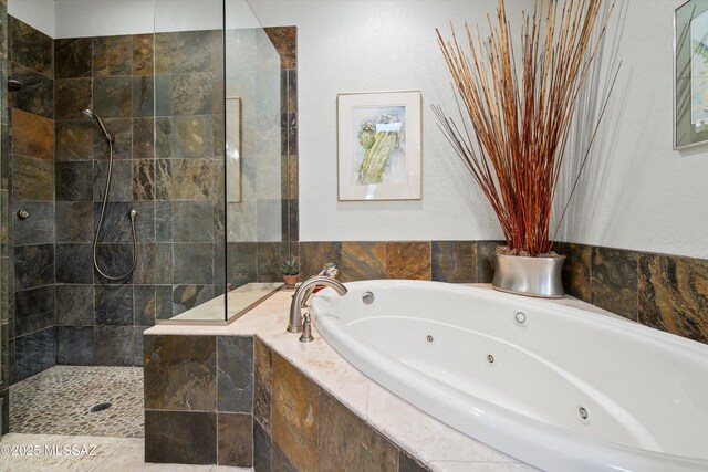 bathroom featuring a garden tub, a sink, visible vents, and double vanity