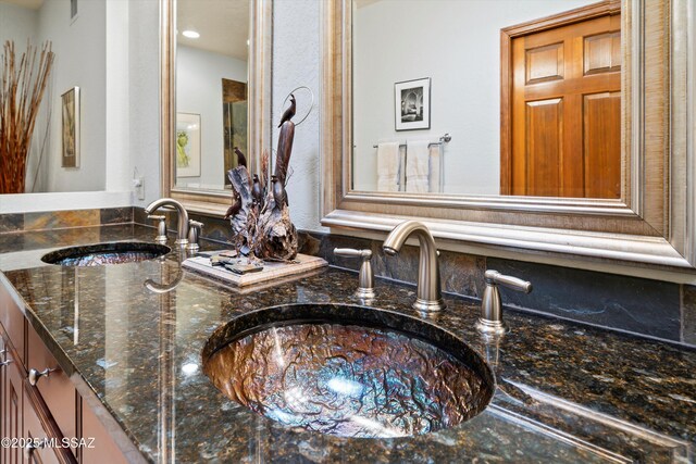 bathroom with double vanity and a sink