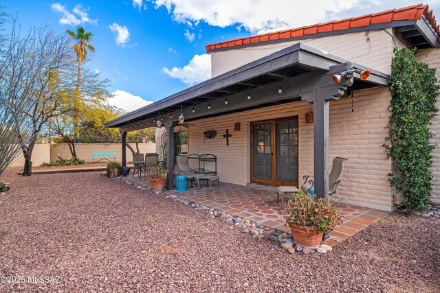 view of community featuring a patio and a fenced backyard