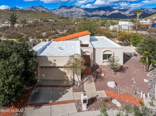 aerial view featuring a mountain view and a residential view