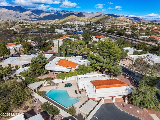 birds eye view of property with a mountain view