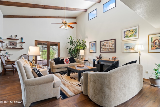 living room with plenty of natural light and dark wood-style flooring