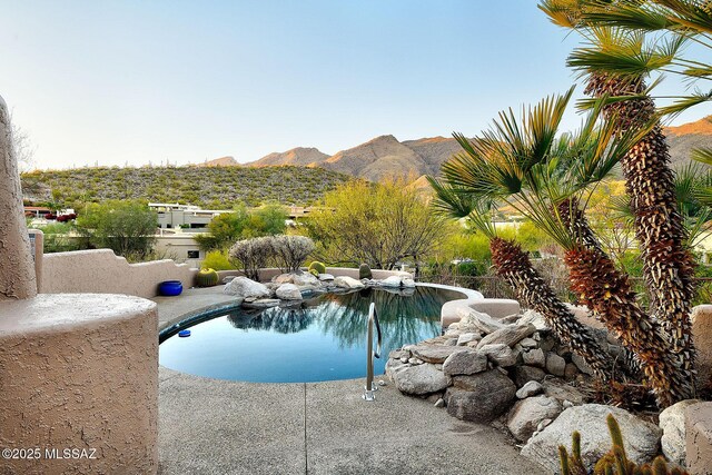 outdoor pool with a mountain view