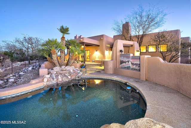 view of pool featuring fence and a fenced in pool