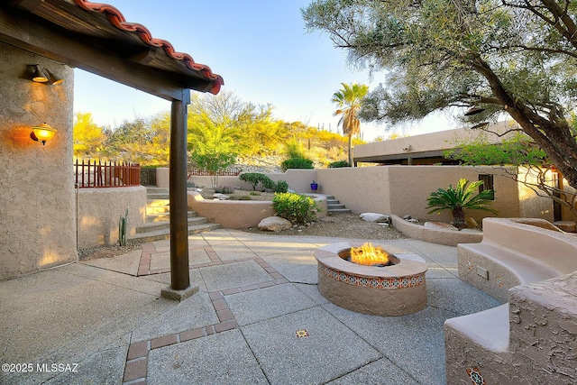 view of patio / terrace with a fenced backyard and a fire pit