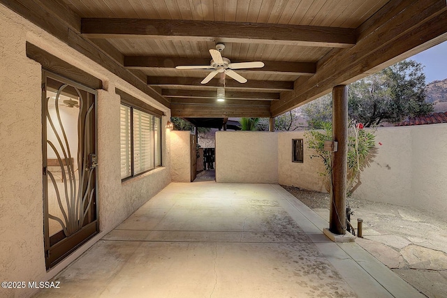 view of patio with fence and a ceiling fan