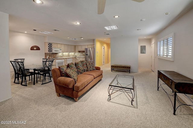 living room with light carpet, ceiling fan, visible vents, and recessed lighting