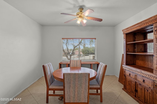 dining room featuring light tile patterned flooring and ceiling fan