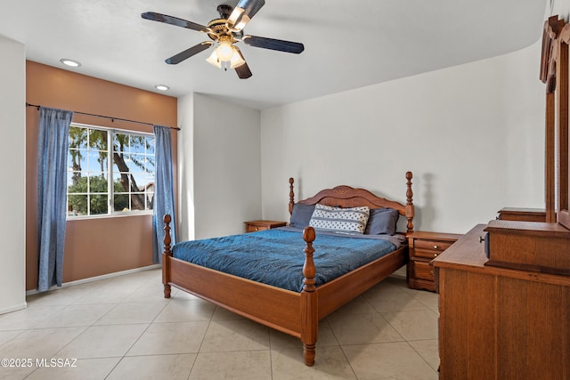 tiled bedroom featuring ceiling fan