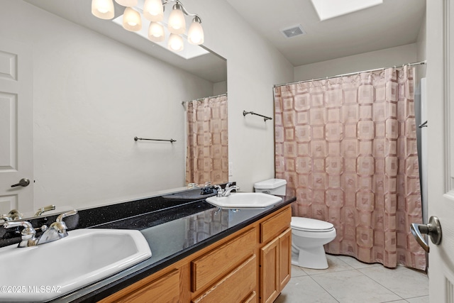 bathroom featuring vanity, tile patterned floors, toilet, and a shower with shower curtain