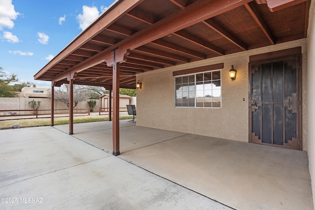 view of patio / terrace with a shed