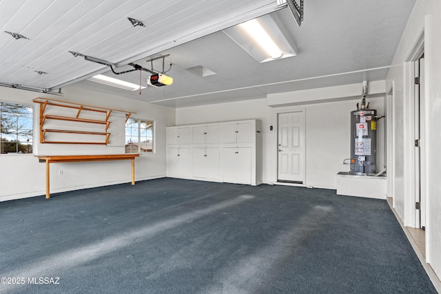 garage featuring water heater and a garage door opener