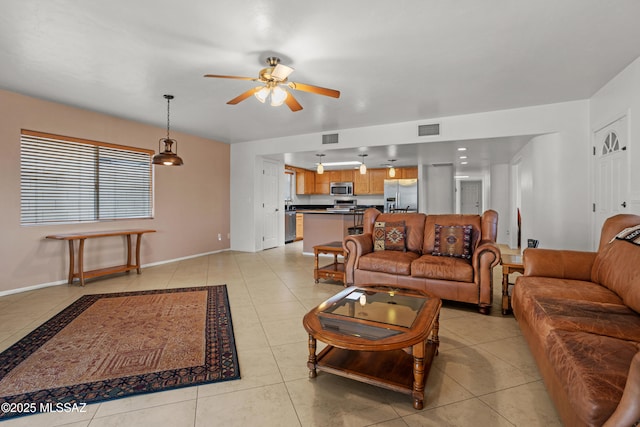 tiled living room featuring ceiling fan