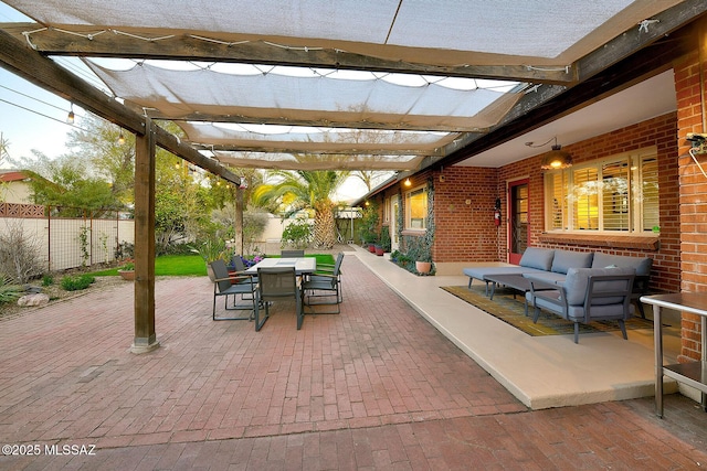 view of patio featuring fence, outdoor lounge area, a pergola, and outdoor dining space