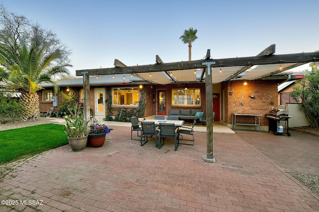 view of patio / terrace featuring outdoor dining space and grilling area