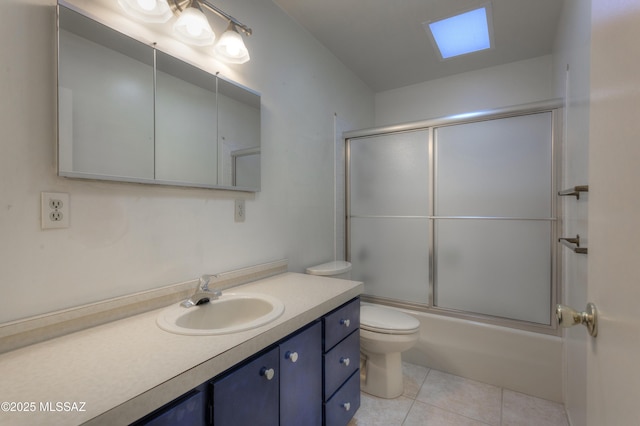 full bathroom with enclosed tub / shower combo, vanity, toilet, and tile patterned flooring