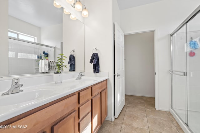 bathroom with vanity, tile patterned flooring, and a shower with shower door