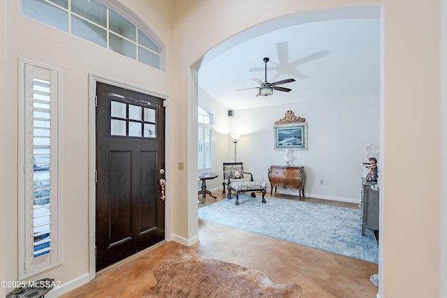 entryway featuring concrete flooring and ceiling fan